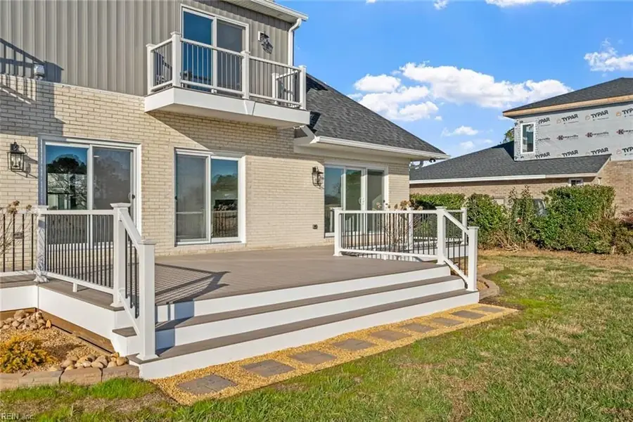 Two-storey rear deck with white railings on a Hampton Roads home