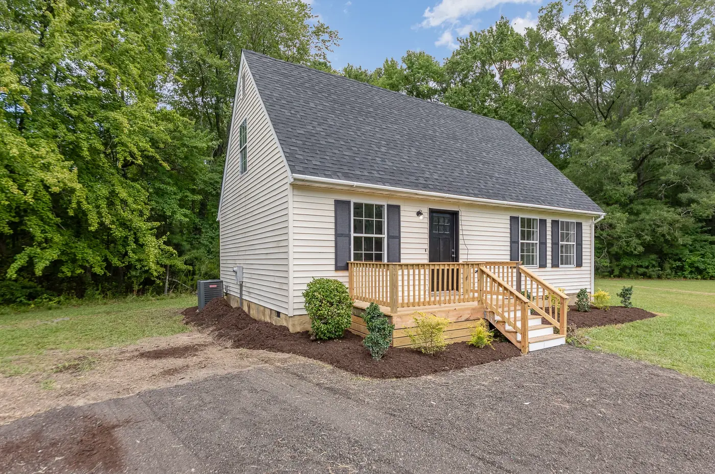 Home exterior with new siding, trim, porch and railings