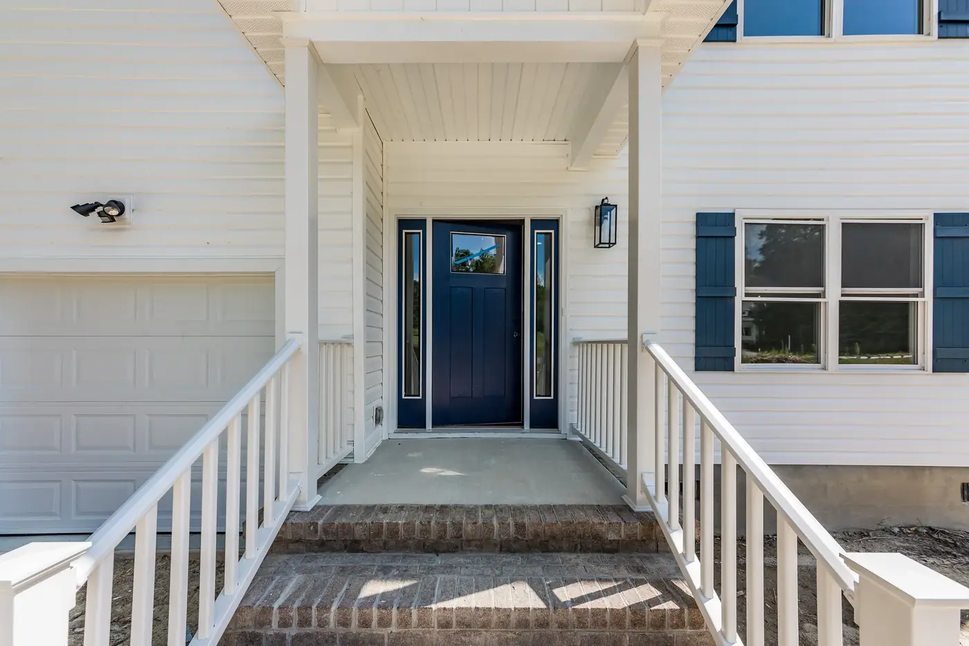 Covered front entry with new porch, columns and steps