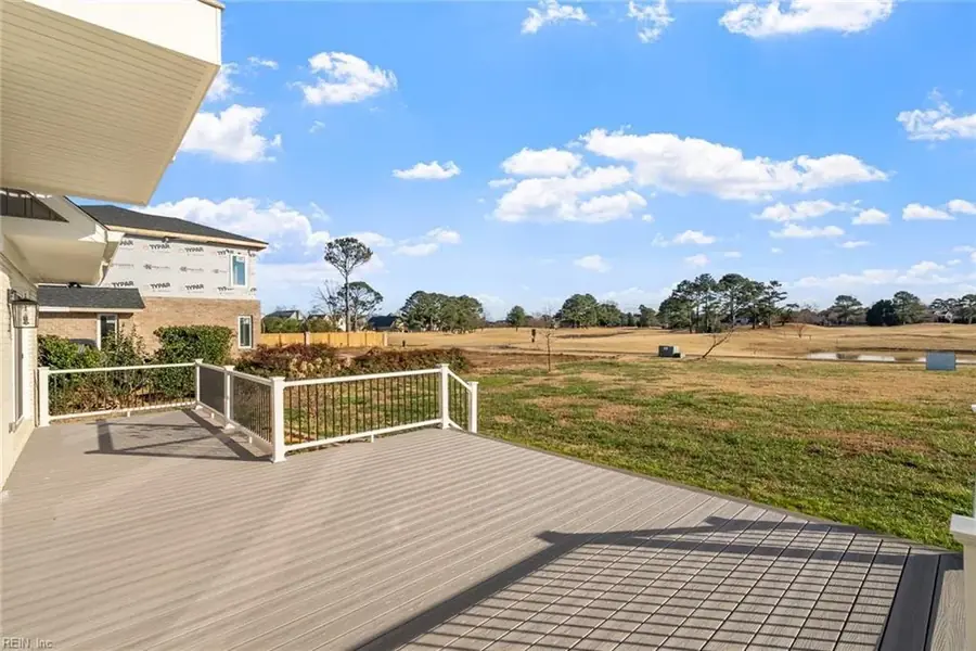 Elevated deck with railings looking out over open ground