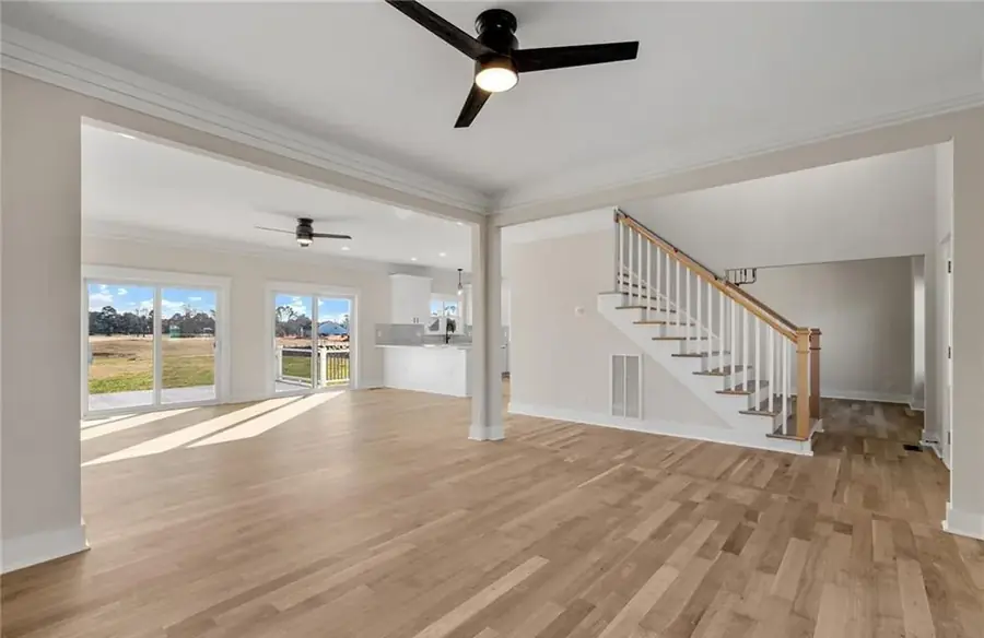 Living space with hardwood-look plank flooring after an interior remodel