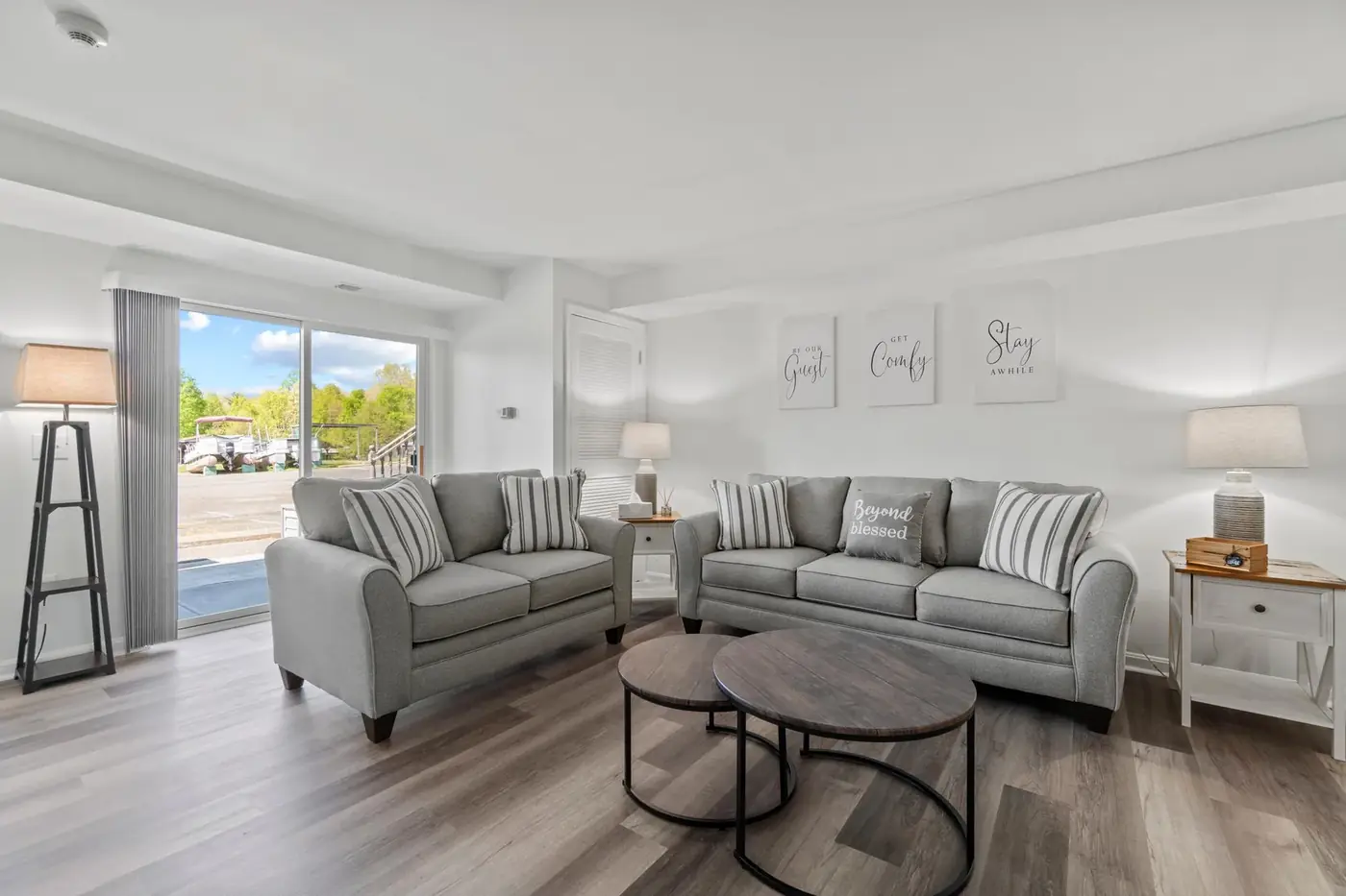 Living room with new flooring, trim and neutral paint after remodelling
